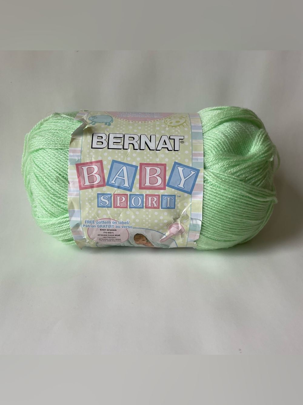 One full skein Bernat Baby Sport yarn SPRITE Green Lot WL151728. 1077 Yds/984m